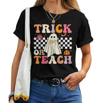 Trick Or Teach Groovy Halloween Retro Floral Ghost Teacher Women T-shirt - Seseable