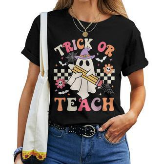 Trick Or Teach Groovy Teacher Halloween Retro Floral Ghost Women T-shirt - Seseable