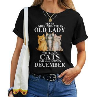 Never Underestimate An Old Lady Who Loves Cats Born December Women T-shirt | Mazezy