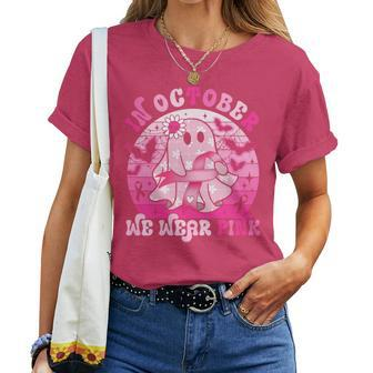 In October We Wear Pink Breast Cancer Groovy Ghost Halloween Women T-shirt - Seseable