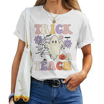 Groovy Teacher Halloween Trick Or Teach Retro Floral Ghost Women T-shirt | Mazezy CA