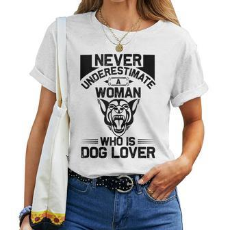 Never Underestimate A Woman Who Is A Dog Lover Dog Women T-shirt - Seseable