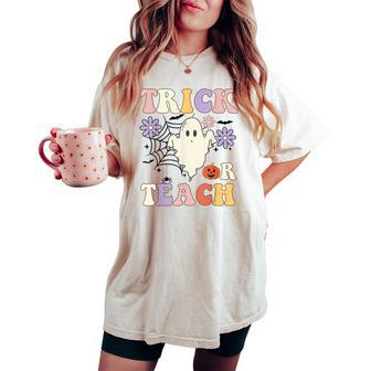 Groovy Teacher Halloween Trick Or Teach Retro Floral Ghost Women's Oversized Comfort T-shirt | Mazezy