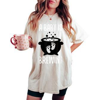 Halloween Pregnancy Announcement For A Baby Is Brewing Women's Oversized Comfort T-shirt - Seseable