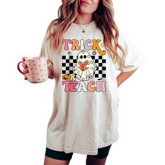 Trick Or Teach Groovy Halloween Retro Floral Ghost Teacher Women's Oversized Comfort T-shirt | Mazezy