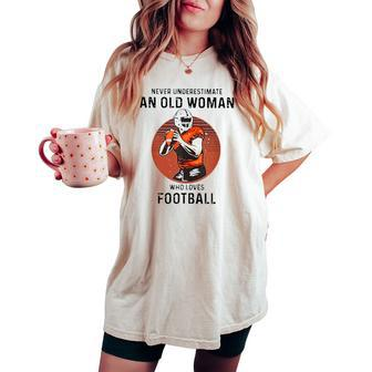 Never Underestimate An Old Woman Who Loves Football Women's Oversized Comfort T-shirt - Monsterry