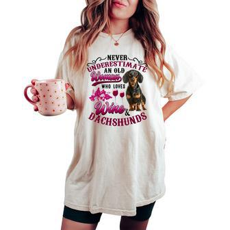 Never Underestimate An Old Woman Who Loves Wine & Dachshunds Women's Oversized Comfort T-shirt | Mazezy