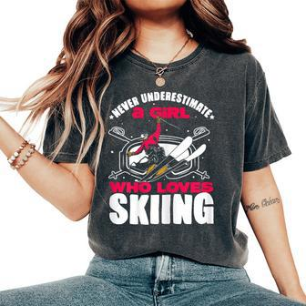 Ski Lovers Never Underestimate A Girl Who Loves Skiing Women's Oversized Comfort T-Shirt | Mazezy