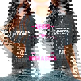 Never Underestimate A Girl With A Book Book Nerd Women's Oversized Comfort T-Shirt | Mazezy