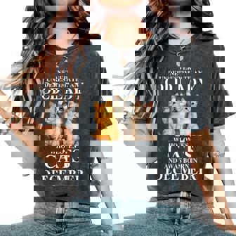 Never Underestimate An Old Lady Who Loves Cats Born December Women's Oversized Comfort T-Shirt | Mazezy