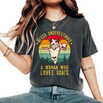 Never Underestimate A Woman Who Loves Goats Women's Oversized Comfort T-Shirt - Monsterry