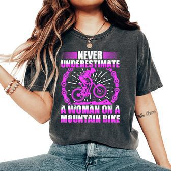 Never Underestimate A Woman On A Mountain Bike Women's Oversized Comfort T-Shirt - Monsterry UK