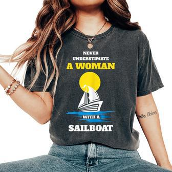 Never Underestimate A Woman With A Sailboat Women's Oversized Comfort T-Shirt - Seseable