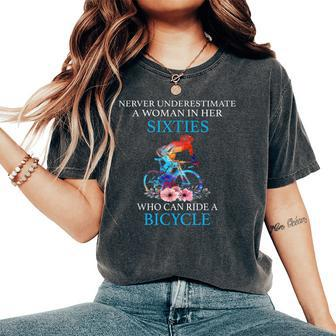 Never Underestimate A Woman In Her Sixties Who Bicycle Women's Oversized Comfort T-Shirt - Thegiftio UK