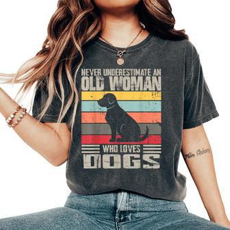 Vintage Never Underestimate An Old Woman Who Loves Dogs Cute Women's Oversized Comfort T-Shirt - Seseable