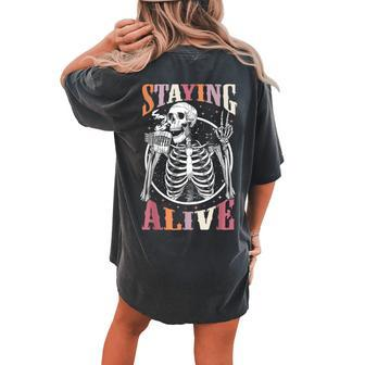Staying Alive Skeleton Drinking Coffee Lover Halloween Women's Oversized Comfort T-shirt Back Print - Monsterry