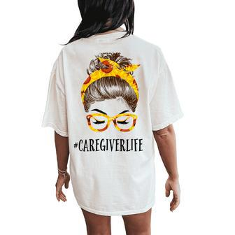 Messy Hair Bun Caregiver Sunflowers Headband Women's Oversized Comfort T-Shirt Back Print | Mazezy