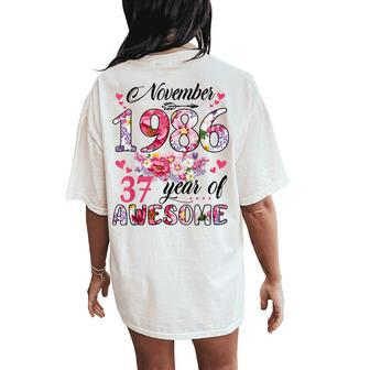 37 Year Old Made In November 1986 Floral 37Th Birthday Women's Oversized Comfort T-Shirt Back Print | Mazezy