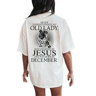 Never Underestimate An Old Lady Believes In Jesus December Women's Oversized Comfort T-Shirt Back Print - Thegiftio UK