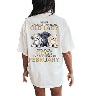 Never Underestimate Old Lady Loves Dogs Born In February Women's Oversized Comfort T-Shirt Back Print - Seseable