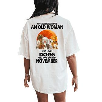 Never Underestimate An Old Woman Who Loves Dogs November Women's Oversized Comfort T-Shirt Back Print - Thegiftio UK