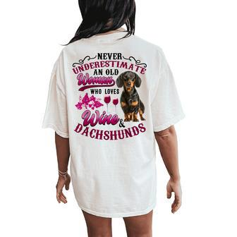 Never Underestimate An Old Woman Who Loves Wine & Dachshunds Women's Oversized Comfort T-Shirt Back Print | Mazezy