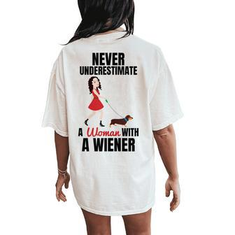 Never Underestimate A Woman With A Wiener Dachshund Women's Oversized Comfort T-Shirt Back Print - Seseable