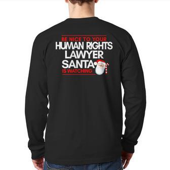 Be Nice To Human Rights Litigation Lawyer Santa Is Watching Back Print Long Sleeve T-shirt | Mazezy