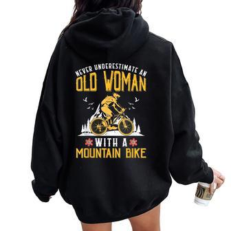 Never Underestimate An Old Woman With A Mountain Bike Women Oversized Hoodie Back Print - Thegiftio UK