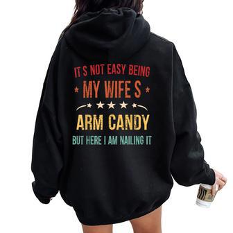 It's Not Easy Being My Wife's Arm Candy Here I Am Nailing It Women Oversized Hoodie Back Print | Mazezy