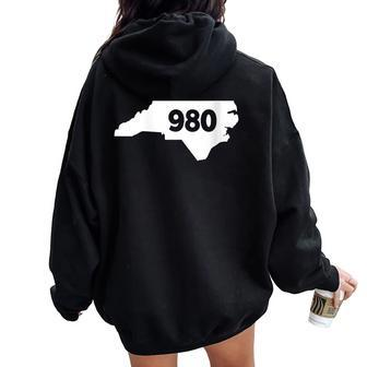 North Carolina 980 Area Code Women Oversized Hoodie Back Print | Mazezy