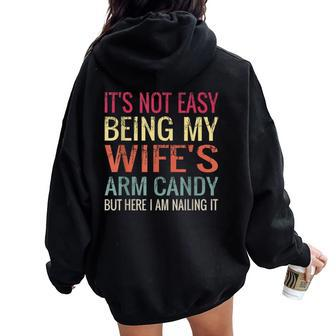 Not Easy Being My Wife's Arm Candy But Here I Am Nailing It Women Oversized Hoodie Back Print | Mazezy