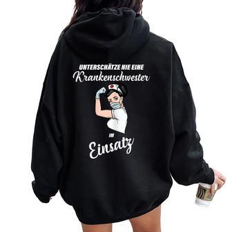 Nursing Underestimates Never A Nursing Women Oversized Hoodie Back Print - Thegiftio UK