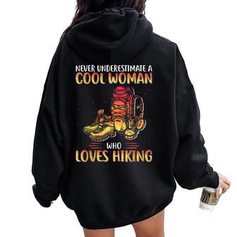 Never Underestimate A Cool Woman Who Loves Hiking Women Oversized Hoodie Back Print - Thegiftio UK