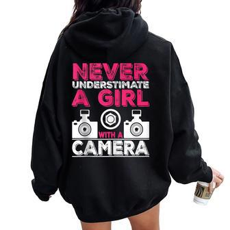 Never Underestimate A Girl With A Camera Girl Photographer Women Oversized Hoodie Back Print - Monsterry AU
