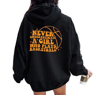 Never Underestimate A Girl Who Plays Basketball Groovy Women Oversized Hoodie Back Print | Mazezy
