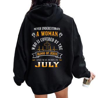 Never Underestimate A July Woman Covered By Blood Of Jesus Women Oversized Hoodie Back Print - Thegiftio UK
