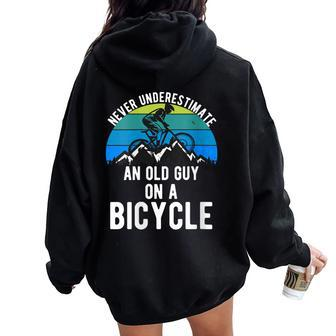 Never Underestimate An Old Guy On A Bike Mountain Mens Women Oversized Hoodie Back Print | Seseable CA