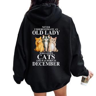 Never Underestimate An Old Lady Who Loves Cats Born December Women Oversized Hoodie Back Print | Mazezy