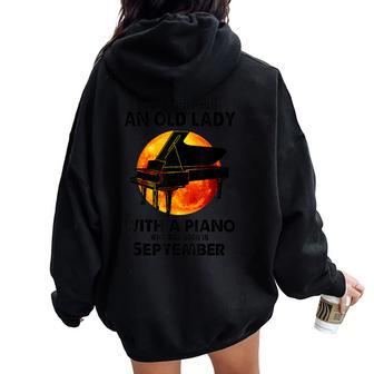 Never Underestimate An Old Lady With A Piano Born September Women Oversized Hoodie Back Print - Thegiftio UK