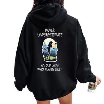 Never Underestimate An Old Lady Who Plays Golf Women Oversized Hoodie Back Print | Mazezy