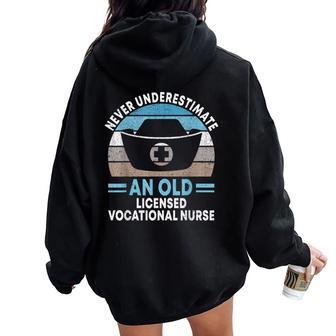 Never Underestimate An Old Licensed Vocational Nurse Lvn Women Oversized Hoodie Back Print - Monsterry