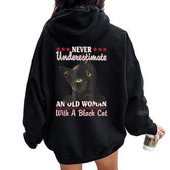 Never Underestimate An Old Woman With A Black Cat Women Oversized Hoodie Back Print | Mazezy