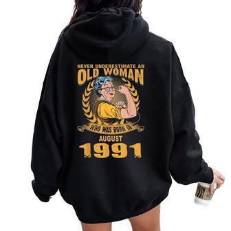Never Underestimate Old Woman Born In August 1991 Women Oversized Hoodie Back Print | Mazezy
