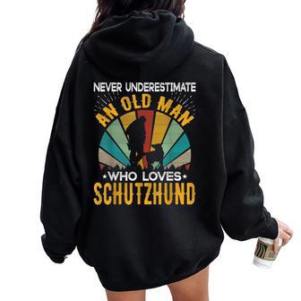 Never Underestimate An Old Woman Who Loves Schutzhund Women Oversized Hoodie Back Print - Thegiftio UK