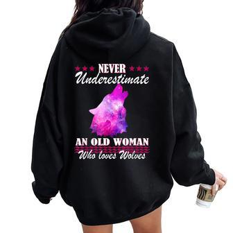 Never Underestimate An Old Woman Who Loves Wolves Women Oversized Hoodie Back Print - Thegiftio UK