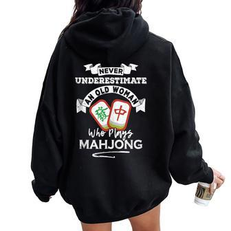 Never Underestimate An Old Woman Who Plays Mahjong Women Oversized Hoodie Back Print - Seseable