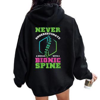 Never Underestimate Woman With Bionic Spine Scoliosis Women Oversized Hoodie Back Print | Mazezy