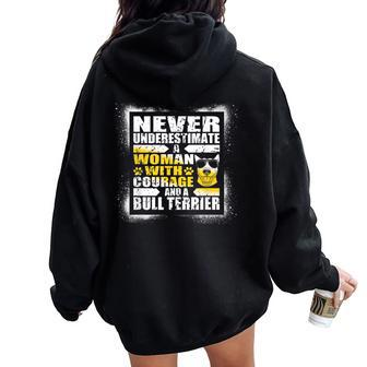 Never Underestimate Woman Courage And A Bull Terrier Women Oversized Hoodie Back Print - Monsterry