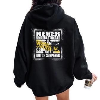 Never Underestimate Woman Courage And A Dutch Shepherd Women Oversized Hoodie Back Print - Monsterry DE